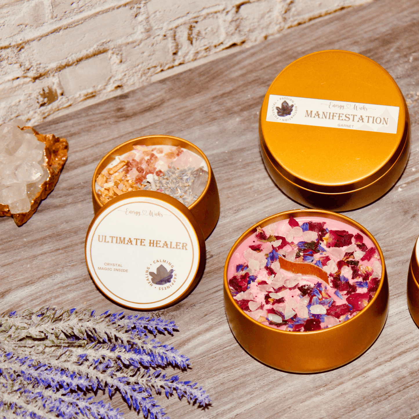 Ultimate Healer Crystal Candle in a sleek gold tin container, adorned with rose quartz and amethyst stones, designed to promote purity, peace, and love. Also empowered with lavender, rose, palo santo, and more. Bath and Body Works Pure Paradise replica scent. Available in two sizes: 4oz and 8oz.
Also features Manifestation Tin Crystal Candle sold by Energy Wicks.